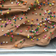 Chocolate Wacky Cake in pan with nonpareil sprinkles